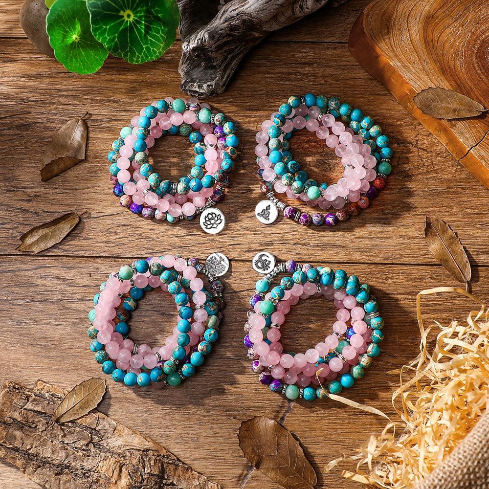 108-bead mala bracelet featuring lotus charm, designed with colorful turquoise, jade, and rose quartz beads for meditation and mindfulness.