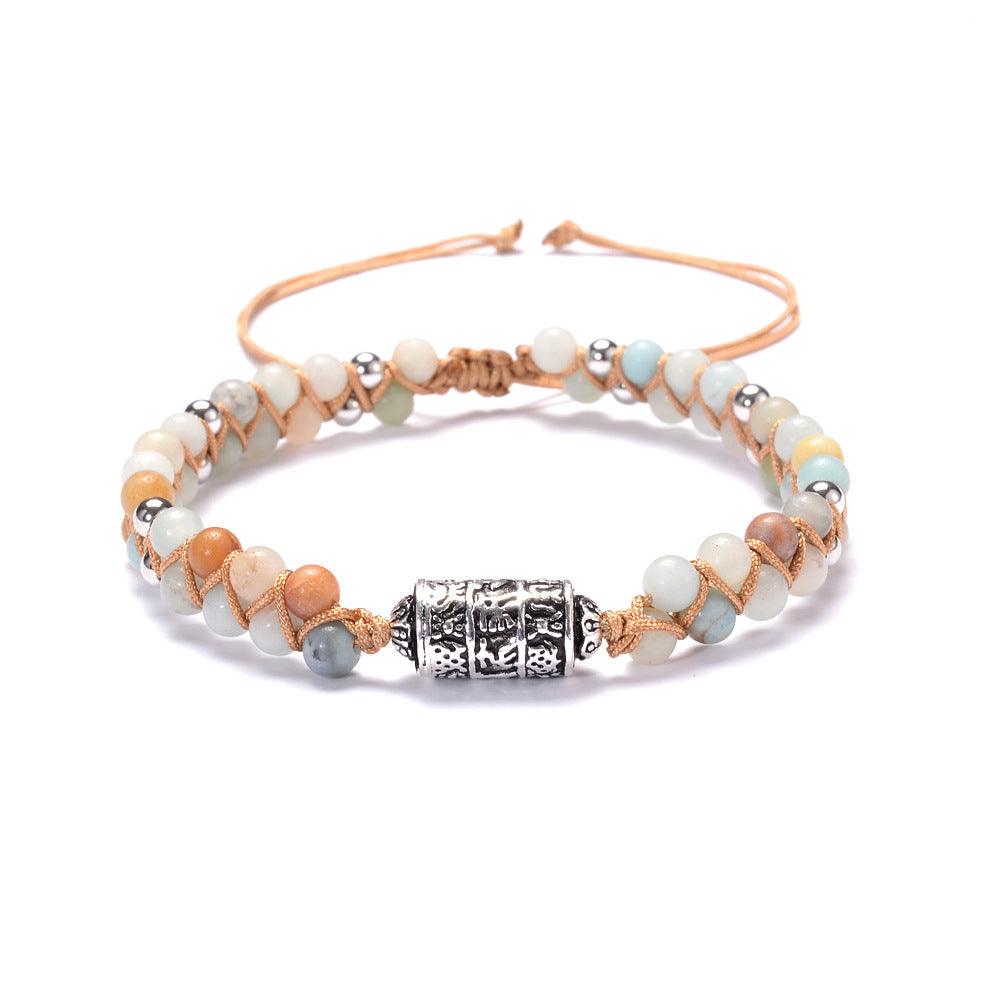 Agate stone bracelet featuring a detailed Tibetan silver prayer wheel charm engraved with the Six-Word Mantra.