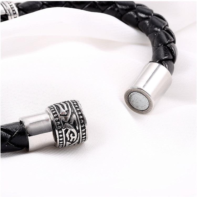 Black braided leather bracelet with magnetic clasp, combining style and convenience.