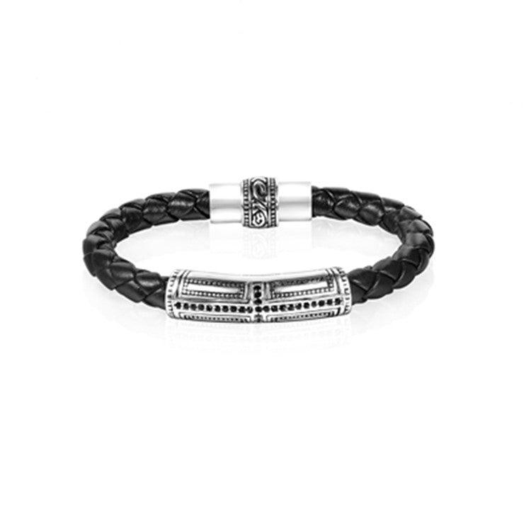 Black leather bracelet with intricate silver details, adding a touch of sophistication.