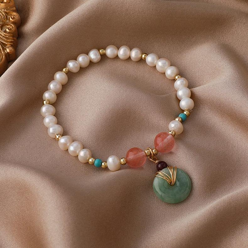 Classic pearl bracelet accented with colorful gemstones, merging traditional elegance with a contemporary color palette for a unique look.