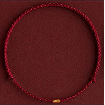 Classic red string bracelet with gold beads, a timeless piece symbolizing blessings and protection.