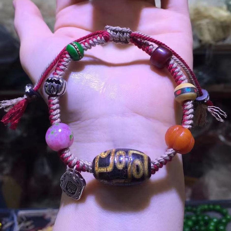 Close-up of Tibetan Dzi bead and colorful accents, blending traditional charm with vibrant modern aesthetics.