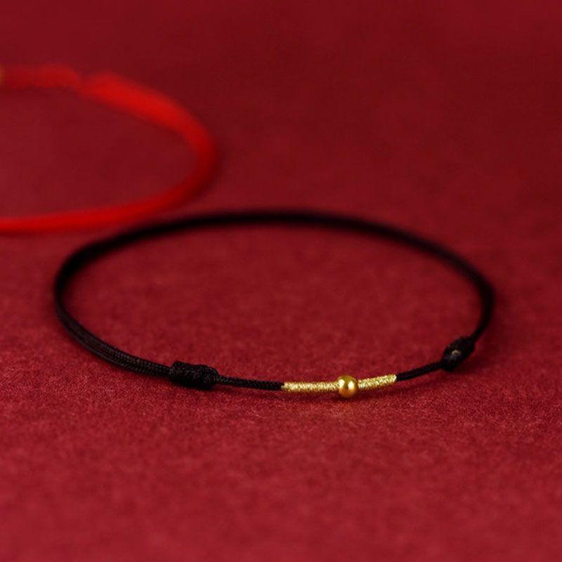 Close-up of gold bead and black rope, adding a refined contrast and luxurious touch to the design.