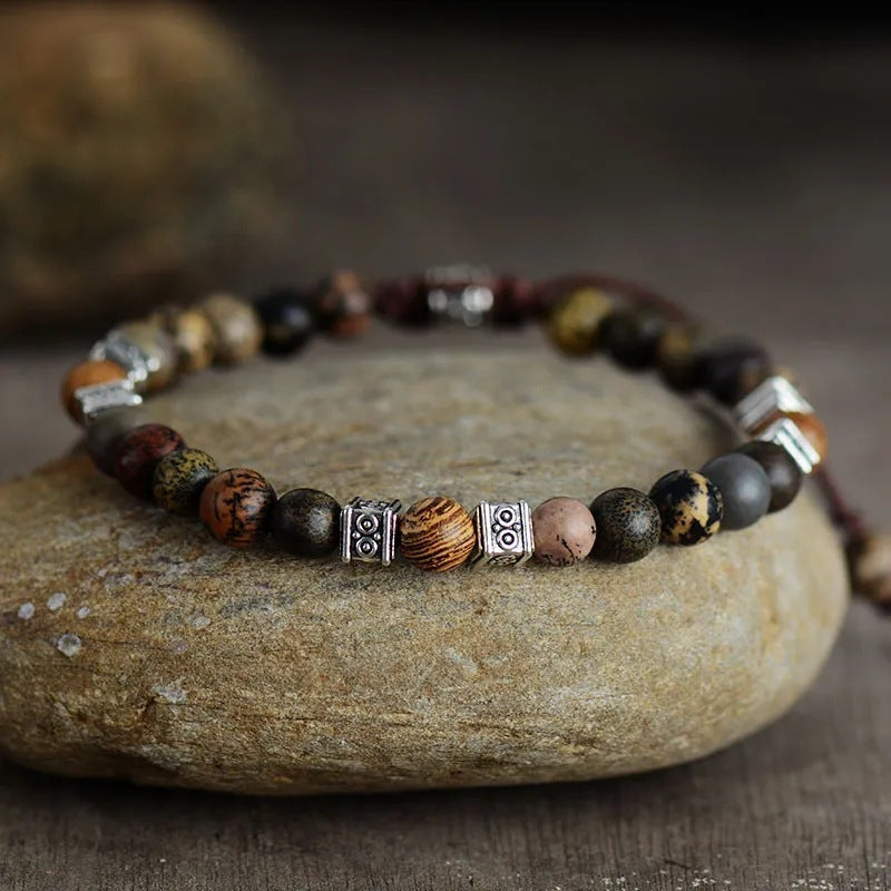 Close-up of handmade boho-style agate bracelet for women showcasing polished bead textures and vintage silver details
