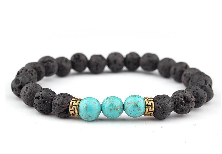 Close-up of lava stone and turquoise bracelet, emphasizing the porous texture of lava beads and the vibrant blue of turquoise.