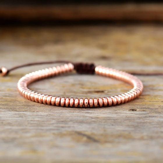 Close-up of the bracelet’s golden Tiger Eye beads, revealing the smooth, polished surface that enhances the wearer’s sense of sophistication.