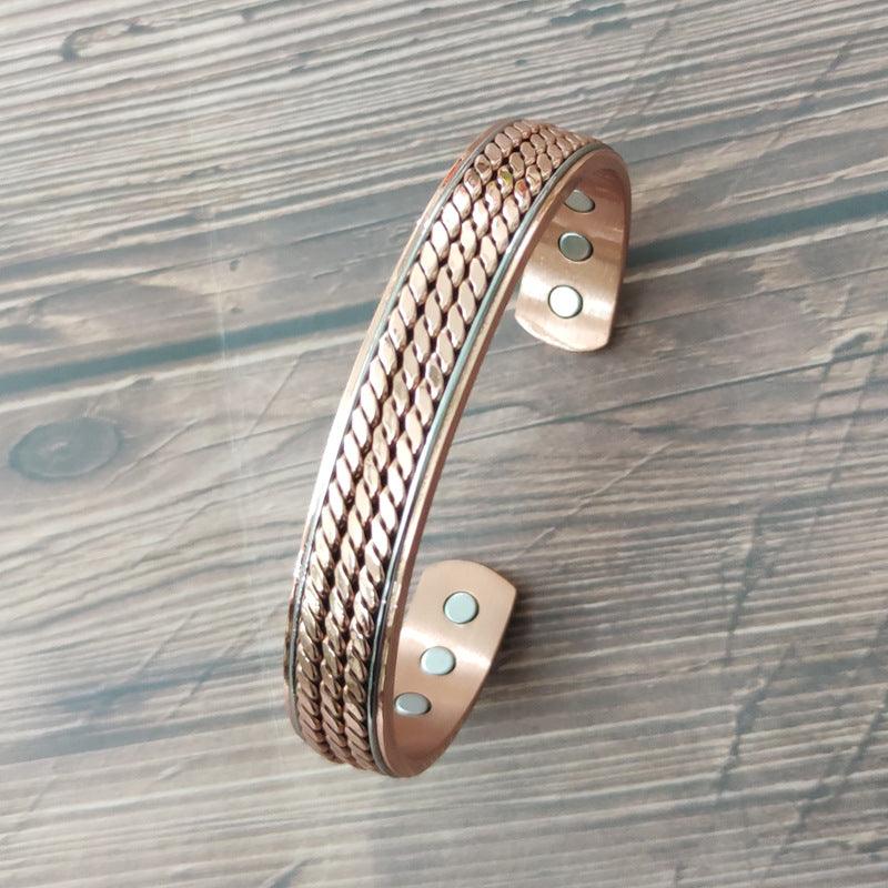 Close-up of the copper bracelet featuring a woven pattern and embedded magnets, showcasing the high-quality finish and therapeutic design.