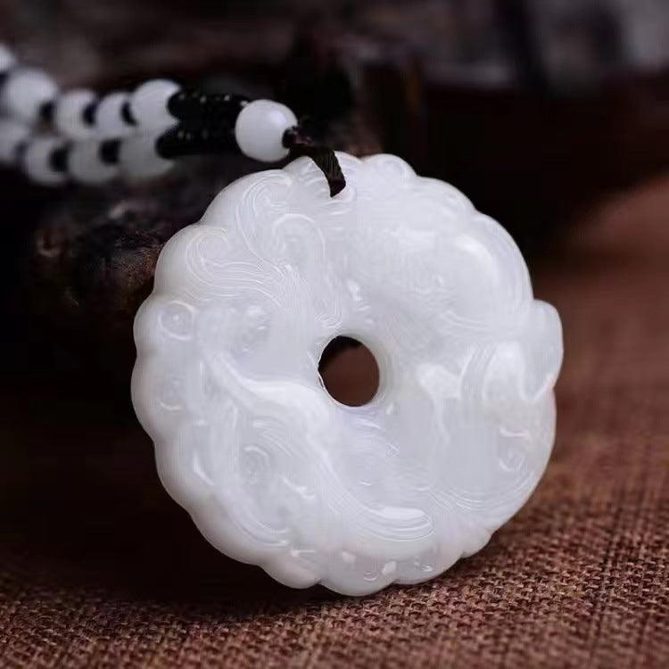 Close-up of the detailed jade carvings, showcasing traditional motifs with refined craftsmanship.
