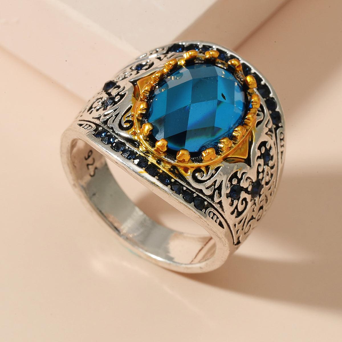 Close-up of the gold setting against the sapphire, creating a striking contrast that enhances the stone’s beauty.