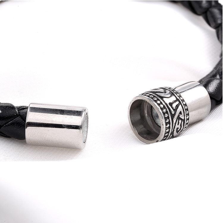 Close-up of the magnetic clasp on a black braided leather bracelet, showcasing secure and stylish detail.