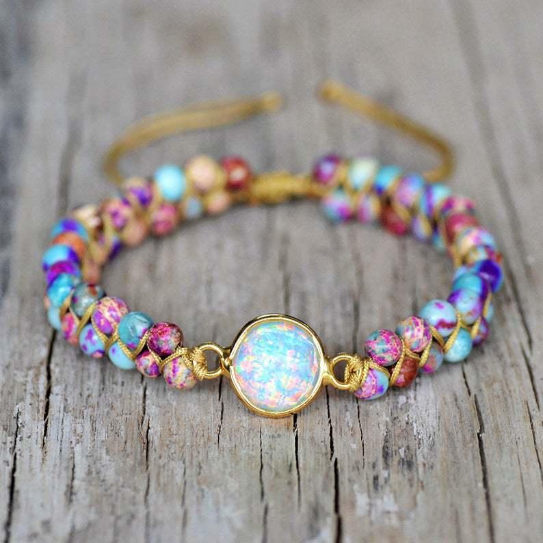 Close-up of the opalescent centerpiece on the bracelet, showcasing the stone’s iridescent glow.