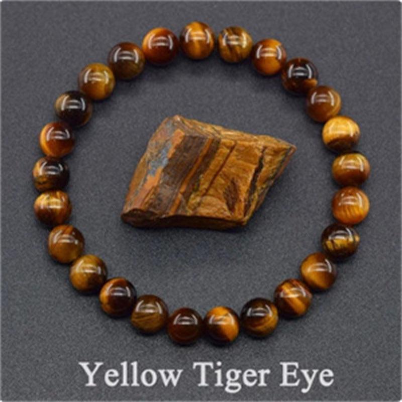 Close-up of the yellow tiger eye beads, highlighting the distinctive golden and brown bands unique to tiger eye stone.