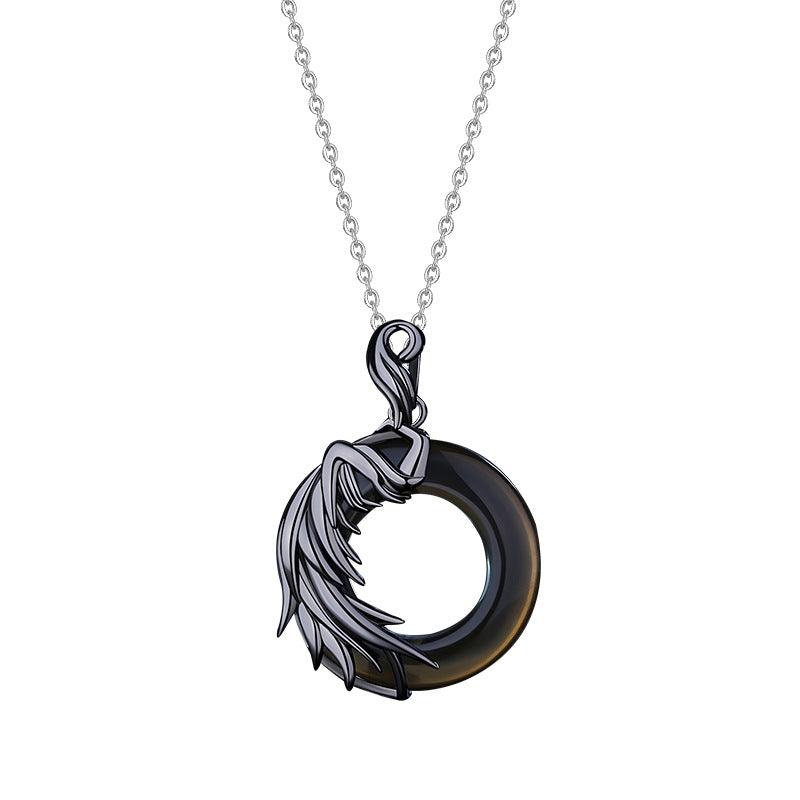 Dark-themed necklace featuring a circular black pendant with an angel wing design, symbolizing the duality of angel and demon, ideal for those seeking symbolic and mysterious jewelry.