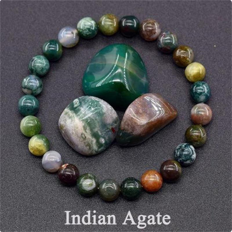 Detailed shot of the Indian agate beads, with shades of green, brown, and grey representing tranquility and resilience.