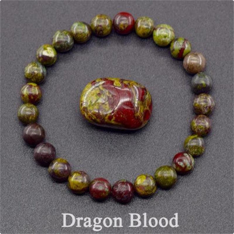 Detailed shot of the dragon blood jasper beads, showcasing the distinctive mix of red and green, which represents courage and energy.