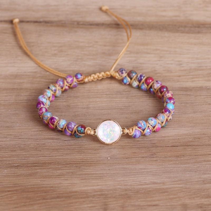 Detailed shot of the opalescent stone and colorful natural beads, symbolizing joy and positivity.