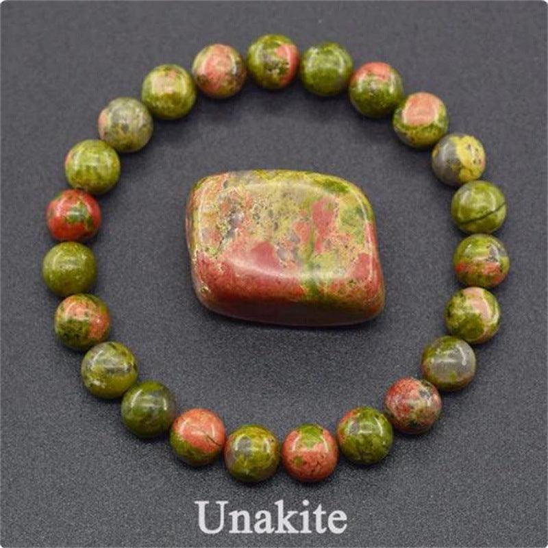 Detailed shot of the unakite beads, capturing the intricate mix of green and pink that enhances spiritual growth and emotional stability.
