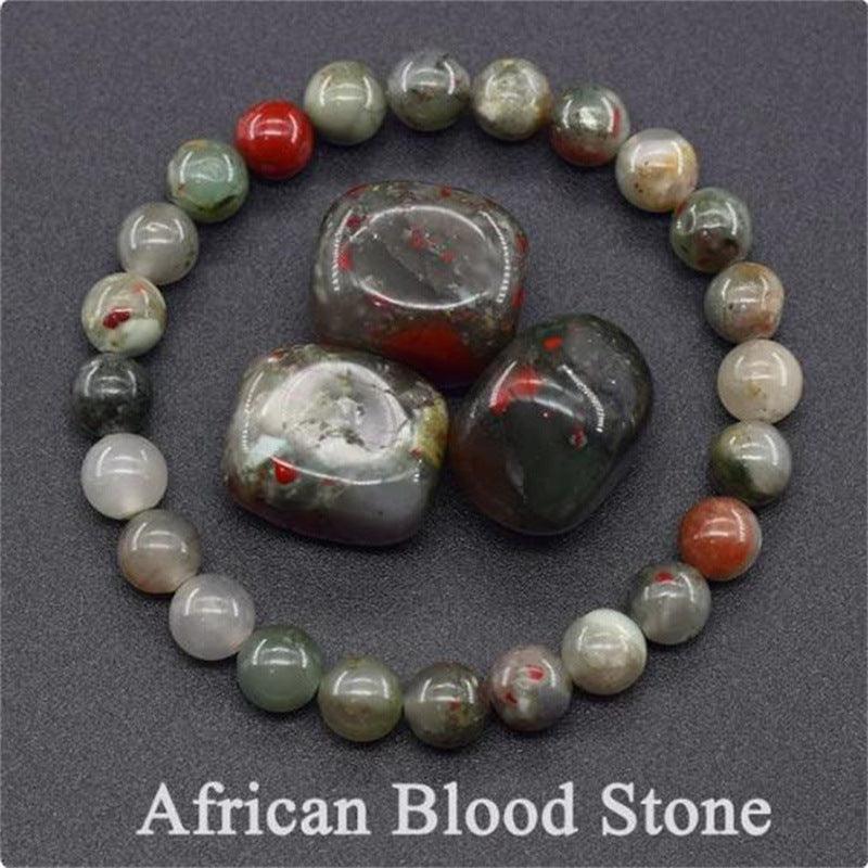 Detailed view of the African Blood Stone bracelet, capturing its unique green base with intense red flecks, a symbol of courage.