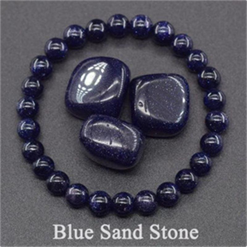 Detailed view of the Blue Sand Stone bracelet, capturing the silver sparkles on a dark blue background, symbolizing wisdom and calmness.