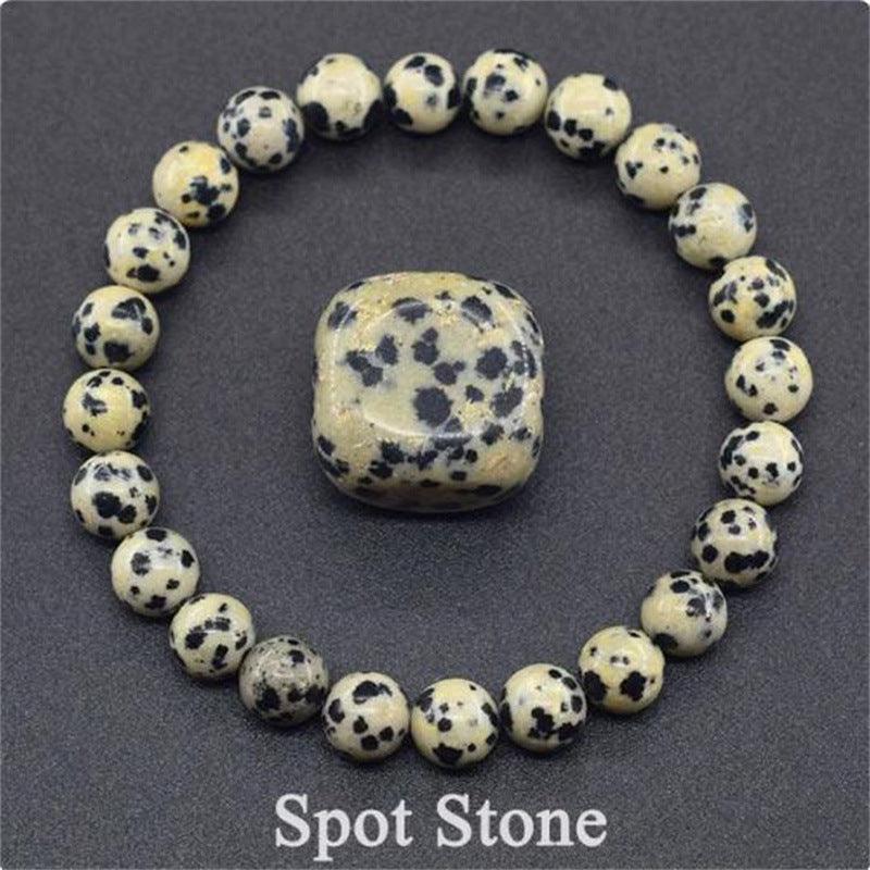 Detailed view of the Dalmatian Jasper bracelet, capturing its unique pattern of black spots, adding a protective and joyful charm.