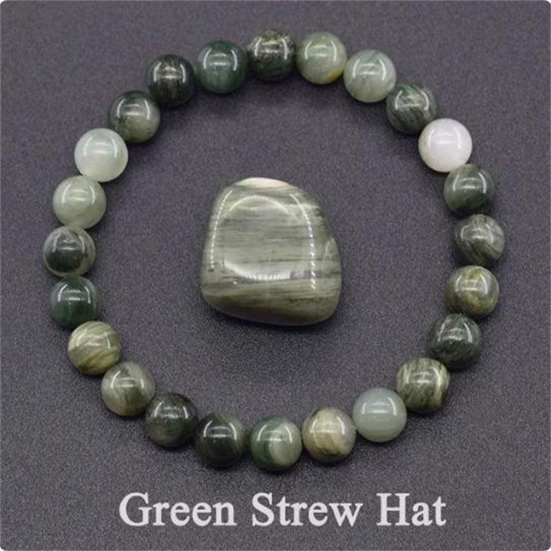 Detailed view of the Green Strew Hat bracelet, capturing its unique blend of green and gray tones that symbolize balance and tranquility.