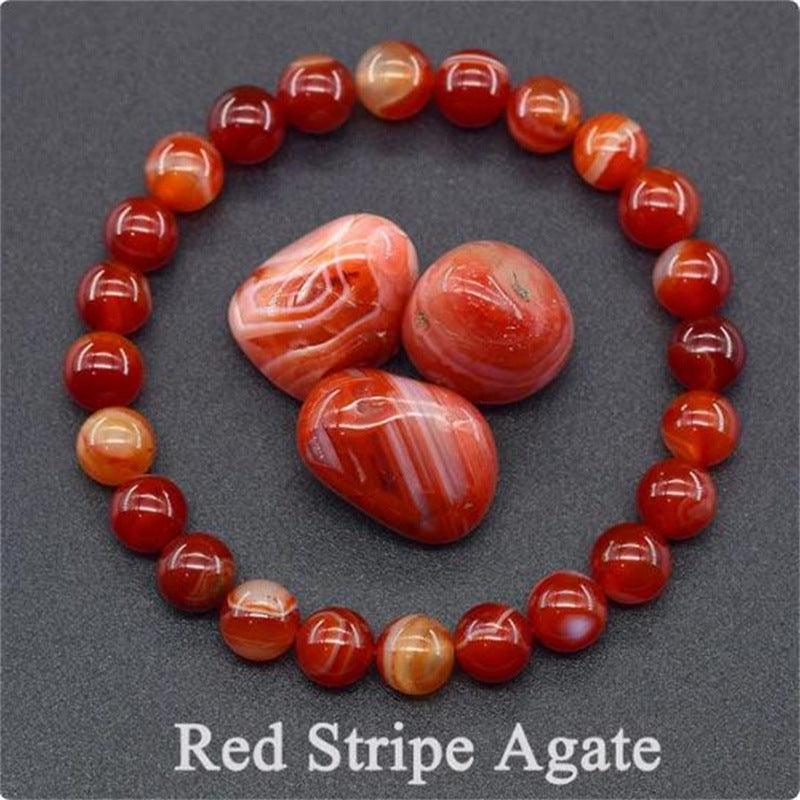 Detailed view of the Red Stripe Agate bracelet, capturing the vibrant red with natural stripe patterns, symbolizing courage and enthusiasm.