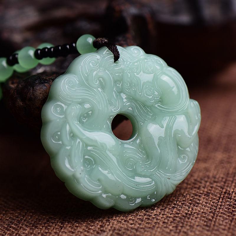 Detailed view of the jade pendant’s smooth texture and glossy finish, adding a sense of luxury