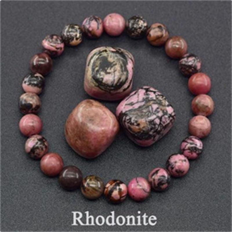 Detailed view of the rhodonite beads, showcasing the craftsmanship and the stone's natural marbled finish.