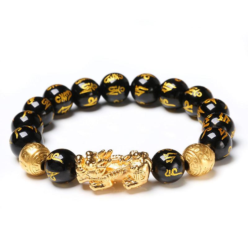 Elegant black and gold bracelet with Pixiu charm and mantra beads, a blend of tradition and luxury for spiritual protection.