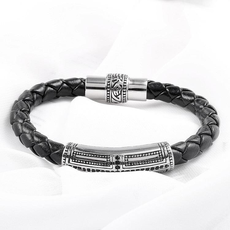 Elegant black braided leather bracelet with silver accents, perfect for a modern look.