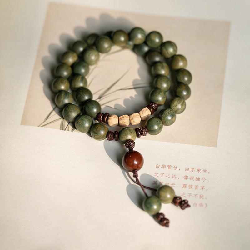 Elegant green wooden mala beads, handcrafted for spiritual connection and calm.