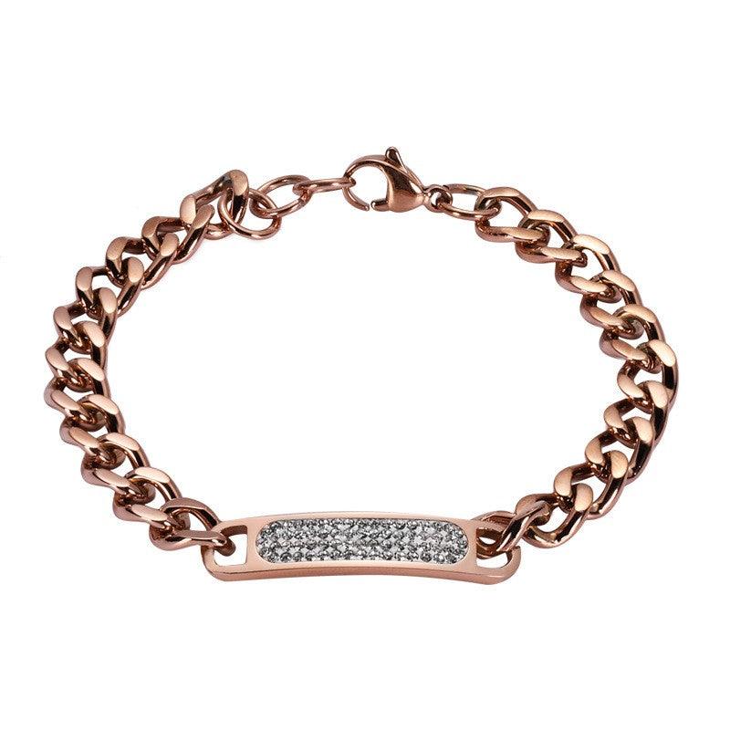 Elegant rose gold chain bracelet with a sparkling crystal bar, perfect for adding a touch of glamour.