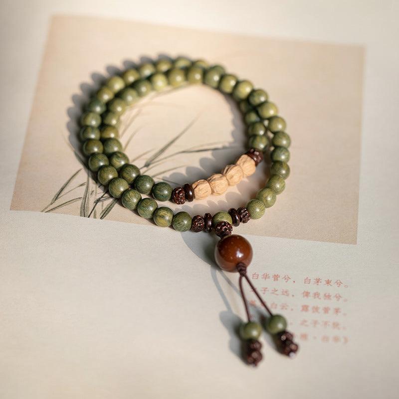Elegant wooden mala beads bracelet, designed for meditation and tranquility.