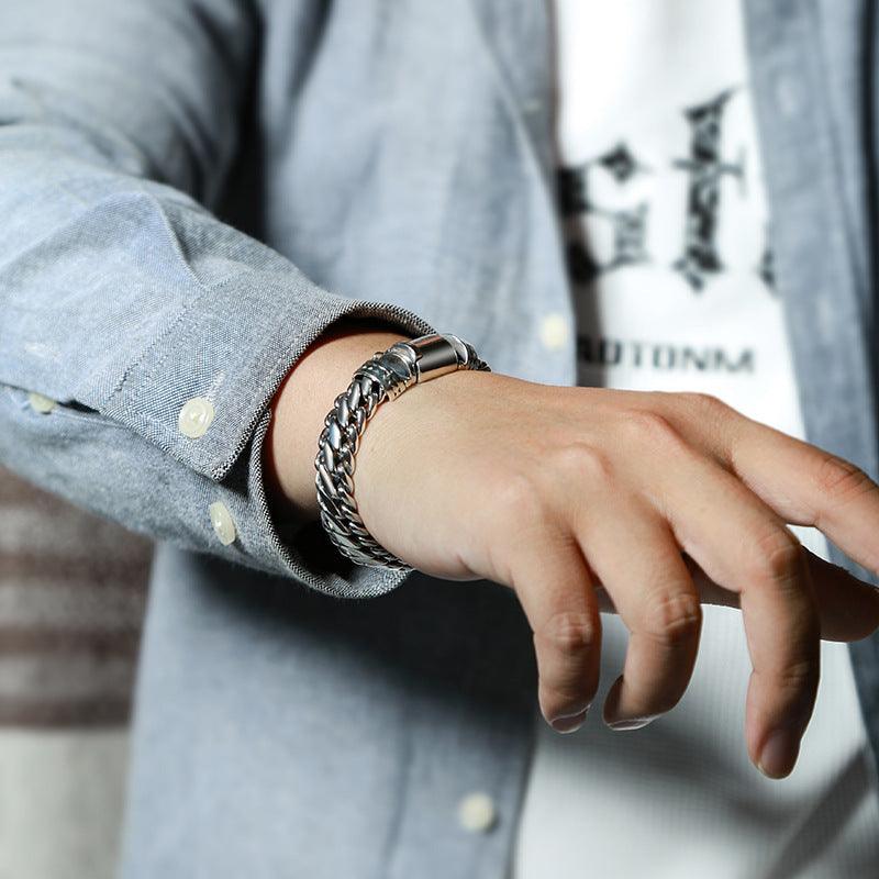 Fashionable copper bracelet on wrist, highlighting a rustic yet elegant accessory for men.