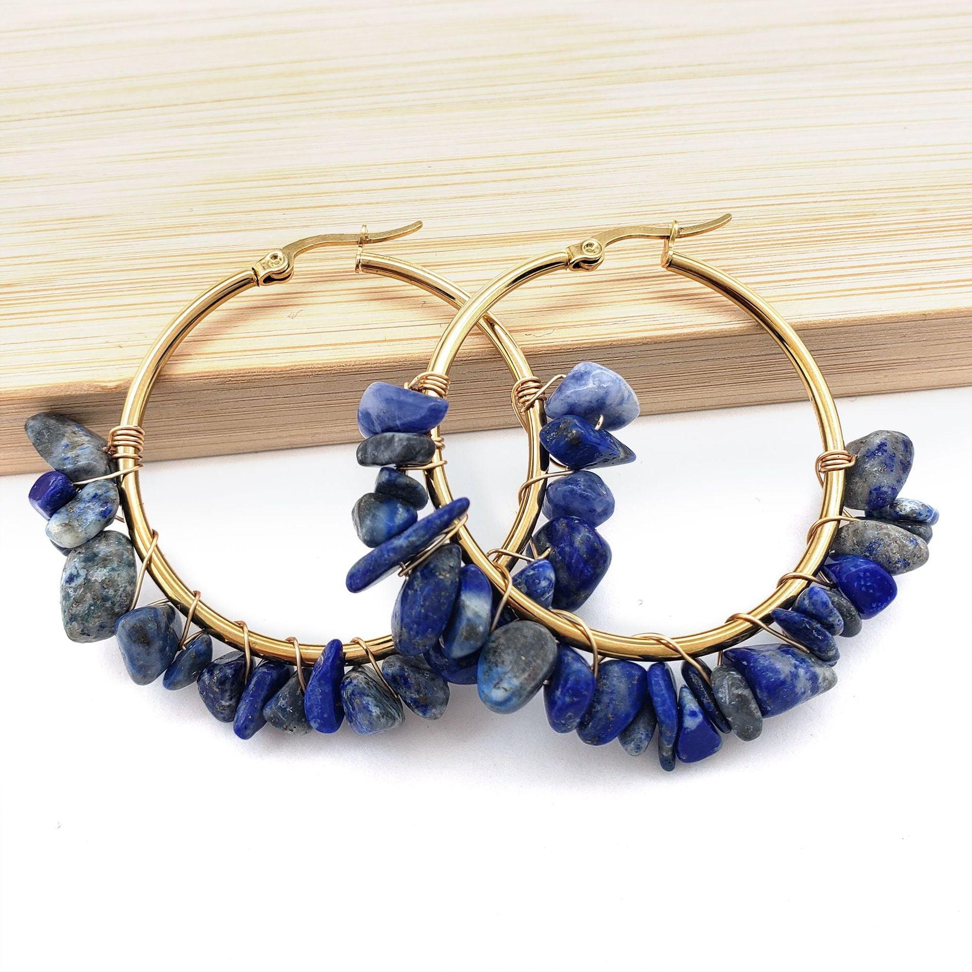 Featuring deep blue stones set in golden earrings, this design symbolizes stability and wisdom. Blue is believed to bring calmness and focus, enhancing communication and understanding, making these earrings an ideal choice for those who value inner calm.