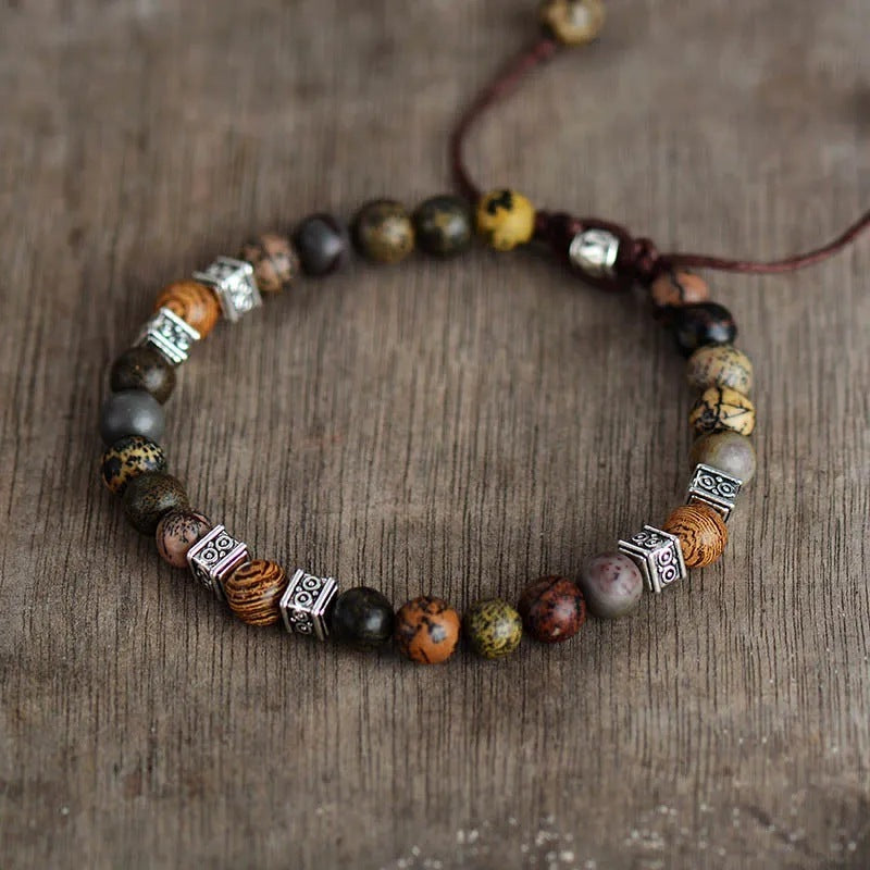 Flat lay of adjustable natural agate bracelet for men featuring vintage silver elements and polished gemstone beads