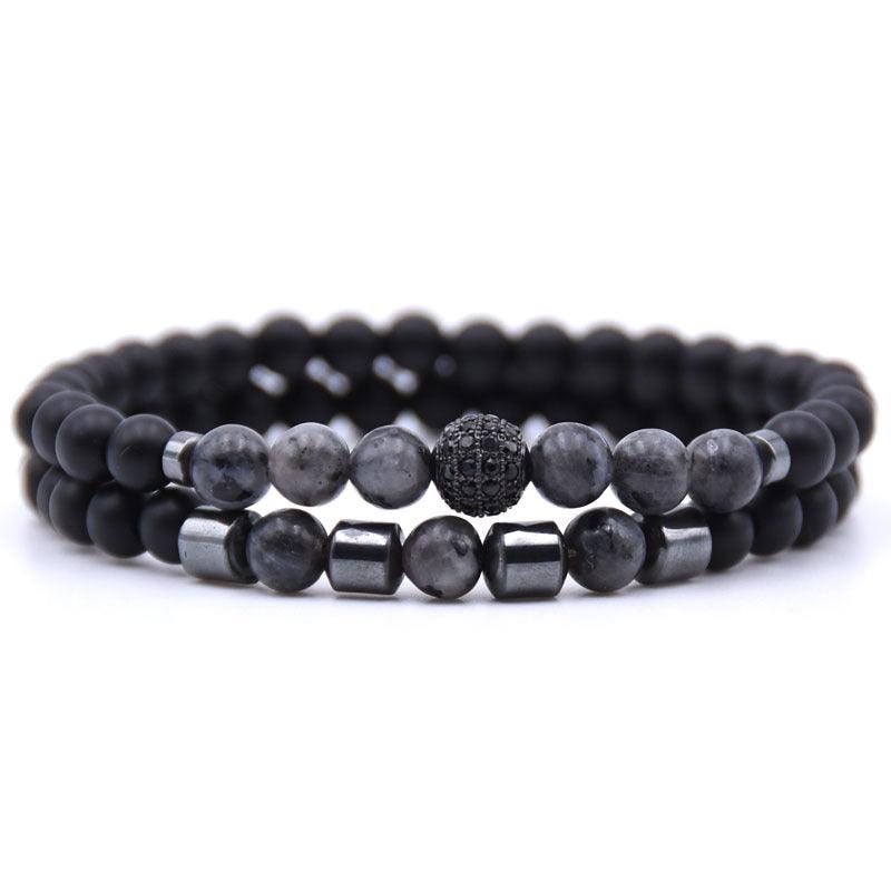 Full view of a bracelet set featuring gray quartz and black obsidian matte beads with metallic accents and a sparkling zircon centerpiece, symbolizing balance and sophistication.