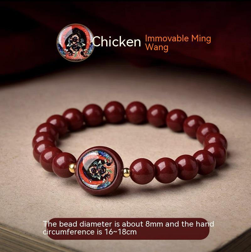Full view of a cinnabar bracelet featuring the Immovable Ming Wang, designed for those born in the Year of the Chicken.