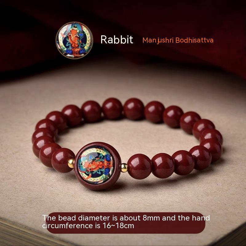 Full view of a cinnabar bracelet featuring the Manjushri Bodhisattva, designed for those born in the Year of the Rabbit.