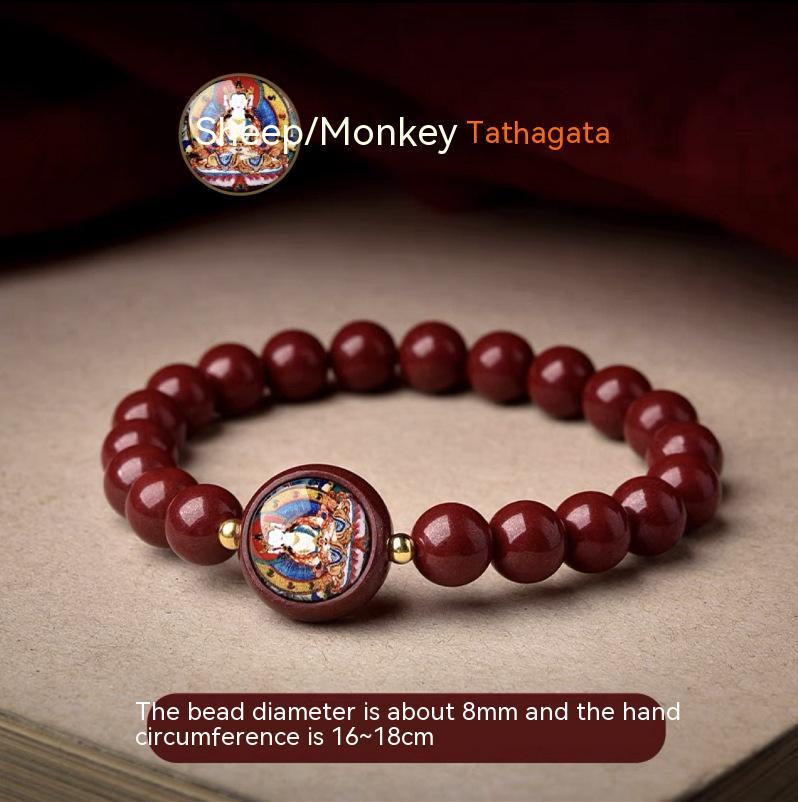 Full view of a cinnabar bracelet featuring the Tathagata Buddha, designed for those born in the Year of the Sheep and Monkey.