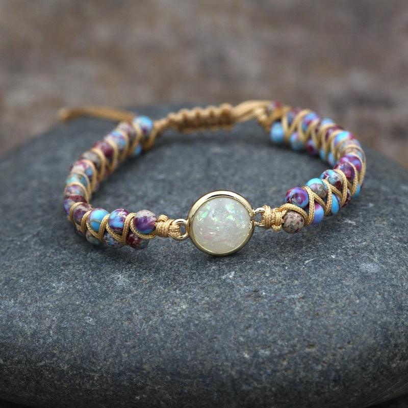 Full view of a gemstone bracelet with a central opalescent stone, surrounded by colorful natural beads.