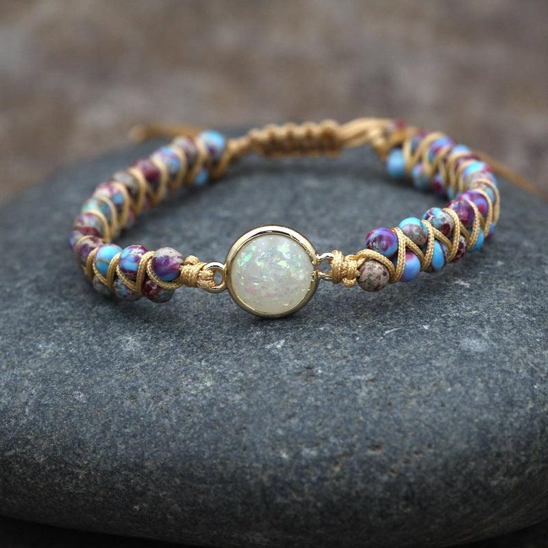 Gemstone bracelet with an opalescent center stone, a symbol of beauty and harmony.