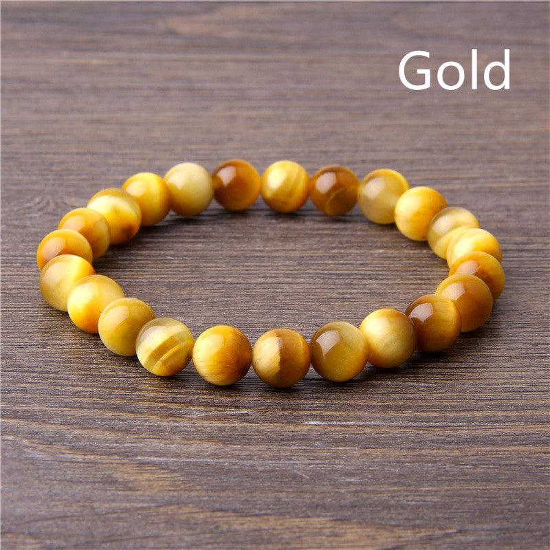 Golden tiger's eye gemstone beaded bracelet for confidence and protection.
