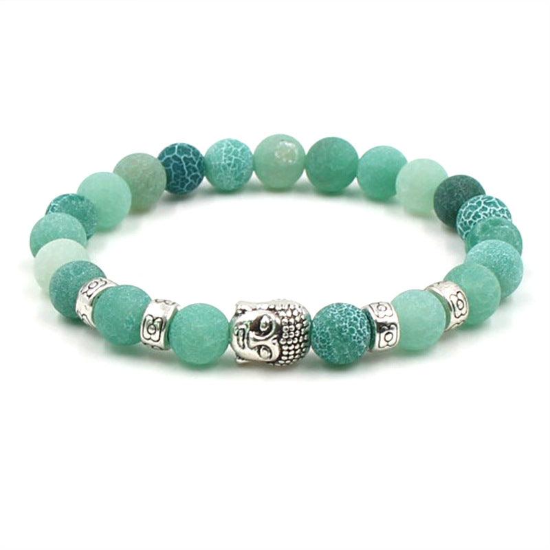 Green turquoise Buddha bracelet with frosted beads, symbolizing peace and inner balance.