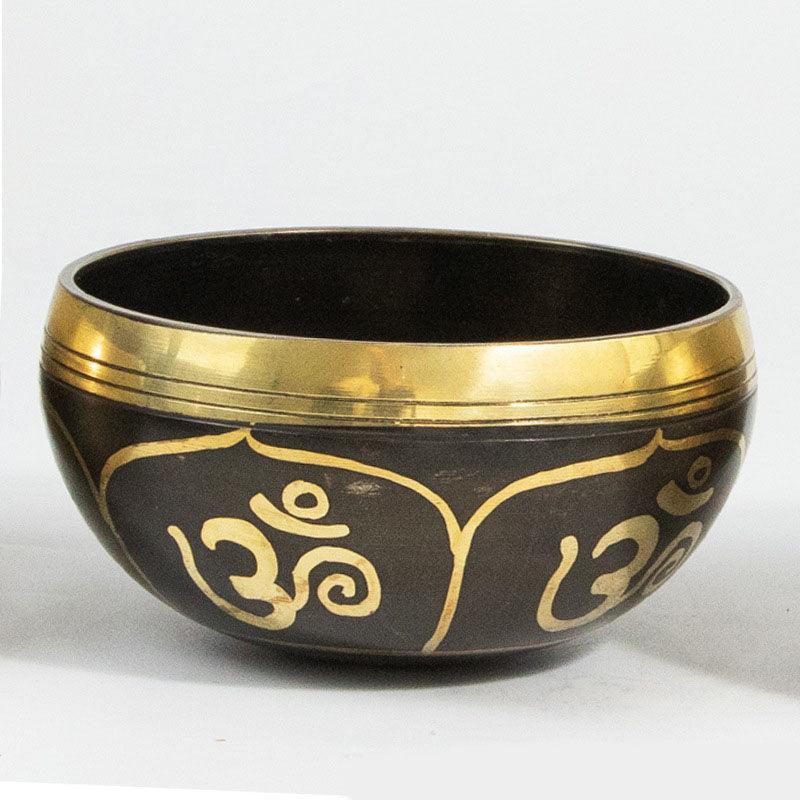 Handcrafted Tibetan singing bowl made of brass, known for its resonant sound that aids in relaxation, focus, and spiritual grounding.