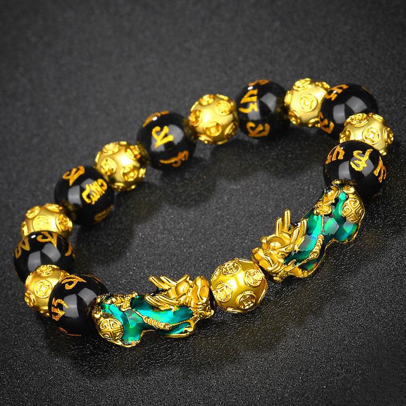 Handcrafted obsidian bracelet with gold Pixiu and six-word mantra, ideal for those seeking spiritual protection.
