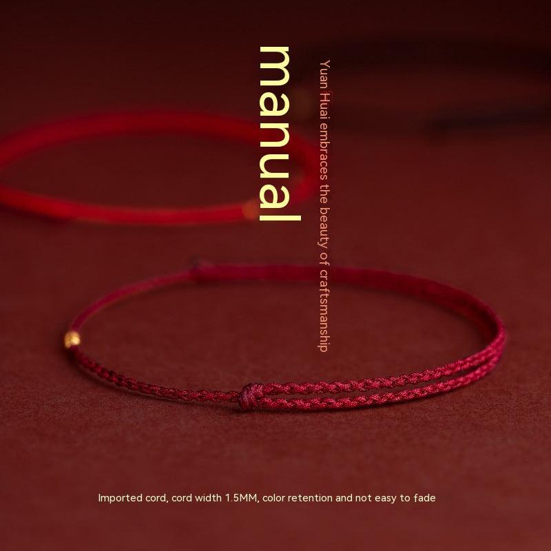 Handmade bracelets in black, deep red, and bright red, adorned with gold beads for an elegant finish.
