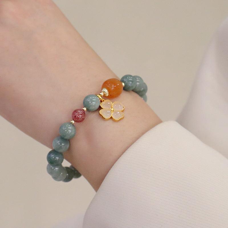 Handmade jade bracelet with carnelian and agate, known for promoting calmness, emotional stability, and spiritual grounding.