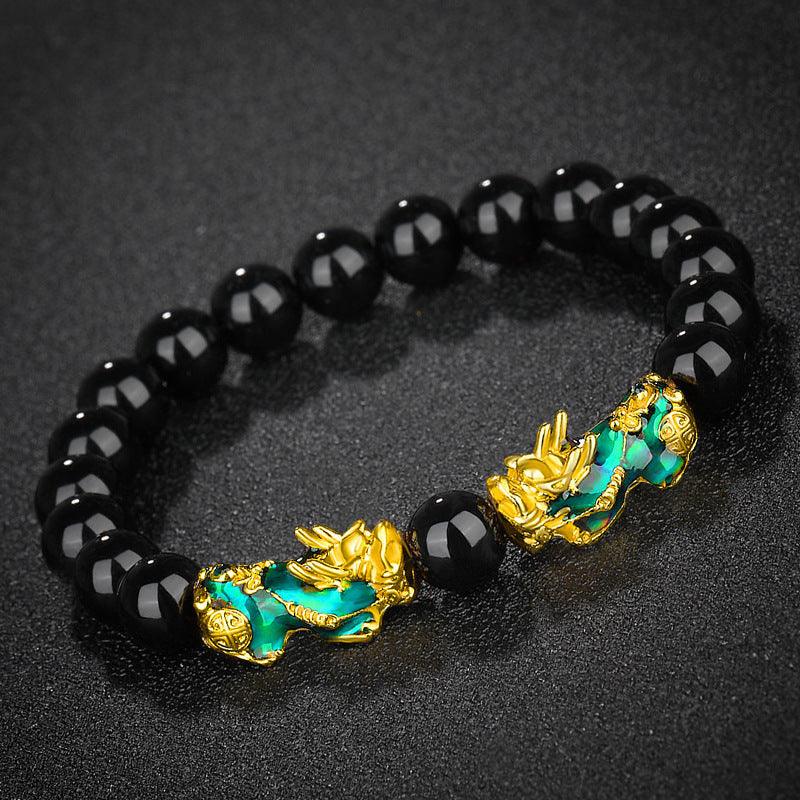 Luxurious black obsidian bracelet with Pixiu and mantra symbols, ideal for wealth and fortune seekers.